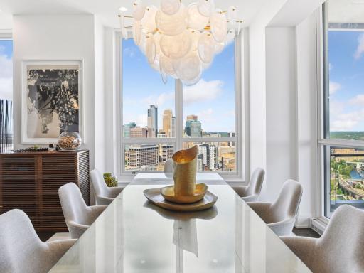 Elegant dining space framed by city views.