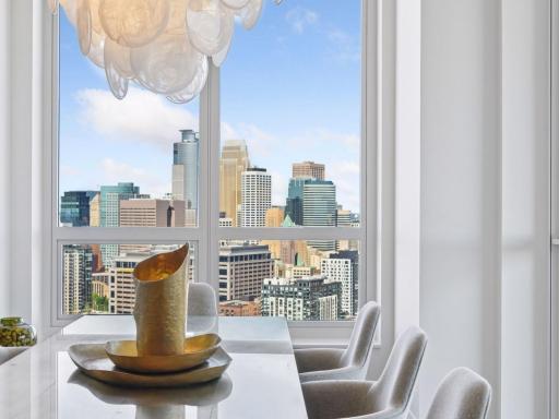 Chic dining area with statement chandelier.