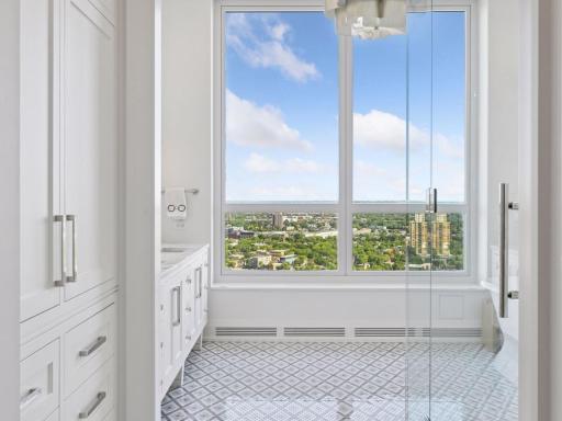 Spa-like primary bath with stunning skyline views.