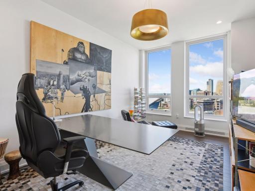 Spacious home office with breathtaking skyline views.