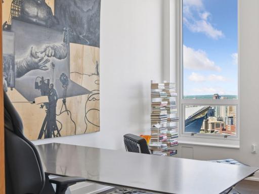 Expansive windows frame downtown Minneapolis, filling the office with natural light.