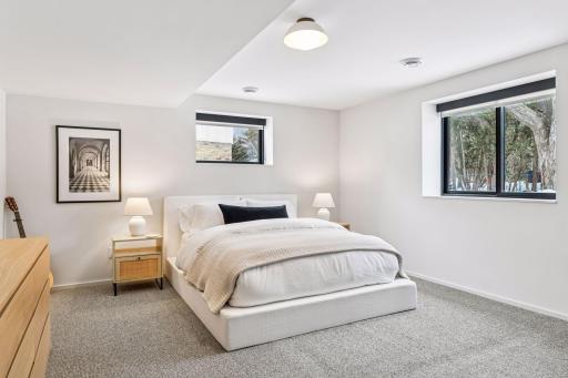Additional bedroom suite on lower level is perfect for multi-generational living or guests.