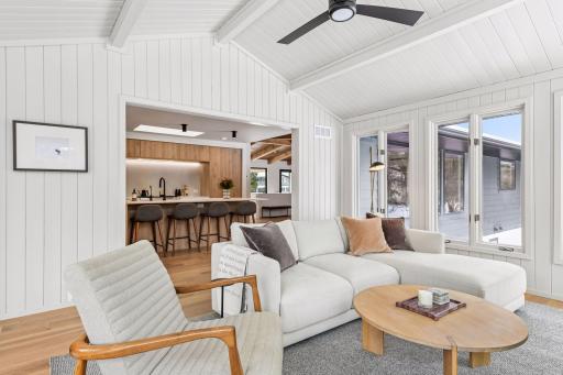 This sun-drenched sunroom offers the perfect gathering space for intimate conversations or lively cocktail parties.