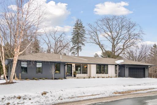 Stunning curb appeal with premium LP SmartSide and designer gray-and-white palette.