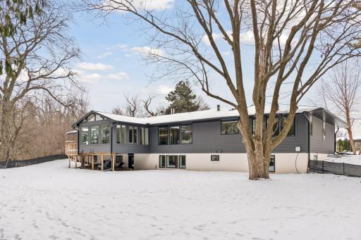 Sophisticated exterior elevation with black-framed windows and custom trim details.