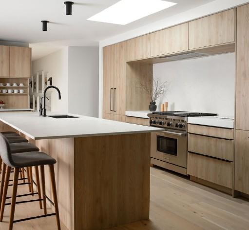 Designer gourmet kitchen featuring integrated appliances and soft-close European cabinetry.