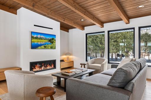 Floor-to-ceiling windows bathe living spaces in natural light. Seamless flow from living to dining to kitchen defines modern luxury lifestyle.
