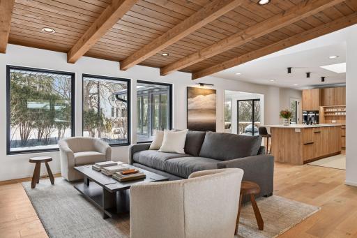 Open-concept living at its finest with seamless flow from great room to gourmet kitchen beneath dramatic vaulted ceilings.