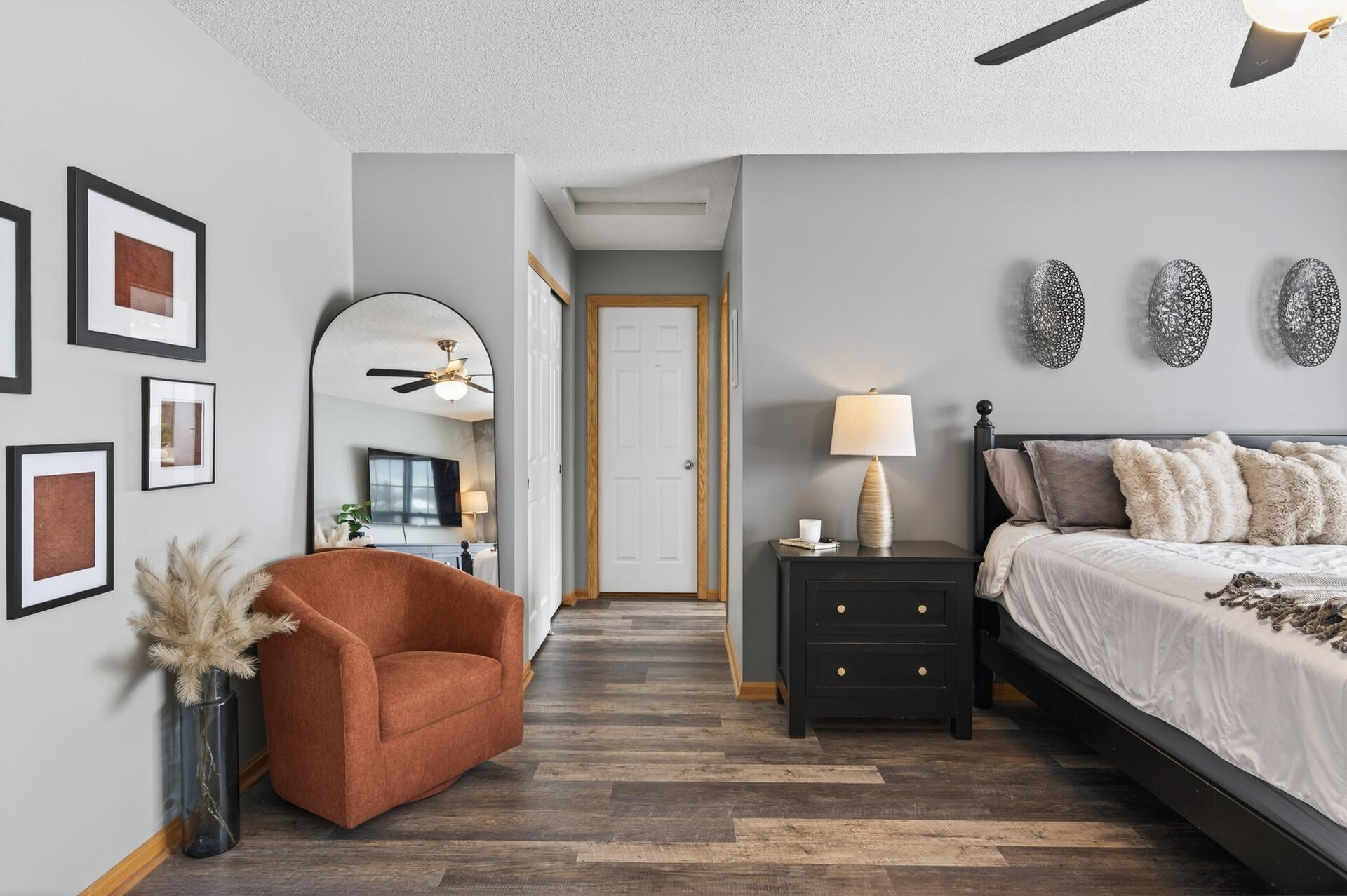 Seating area and view towards bathroom and closets.