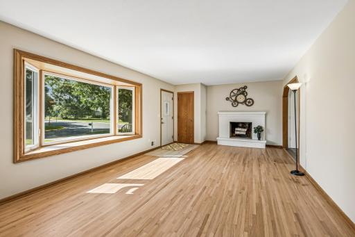 Spacious living room also features a cozy brick wood burning fireplace!