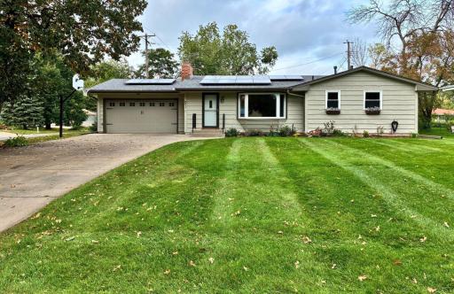 Welcome to 91 65 1/2 Way NE! Beautiful home with many expensive improvements including NEW roof (Sept 2026), solar panels, kitchen, & more!