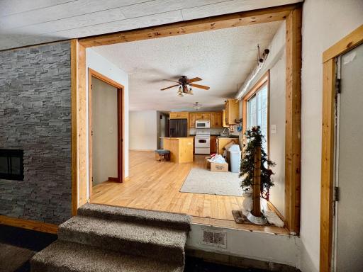 Great room view to the kitchen, dining and walkout to deck and patio