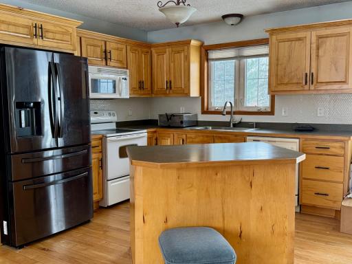 Watch the kids or mother nature through the kitchen window that overlooks the backyard.