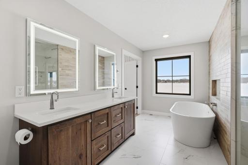 Double sinks with custom cabinets and more lake views!