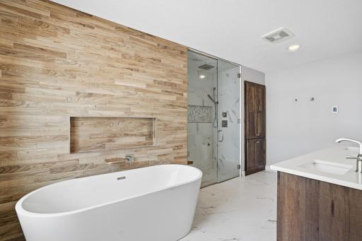 Luxurious primary bathroom with oversized soaking tub!