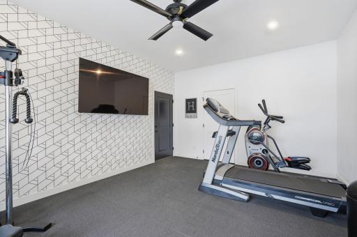 Main level bonus room would be great for additional office, guest bedroom, or toy room, as it's away from the main level living spaces. Currently, an exercise room.