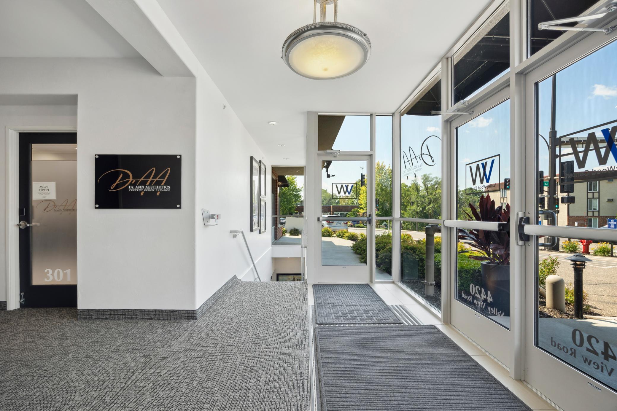 Expansive, window-lined main level workspace with abundant light.