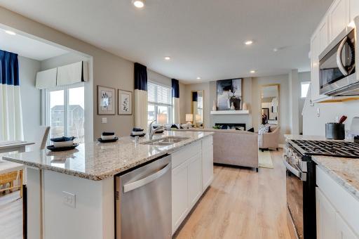 Photo for 968 Stone Creek Drive, Jordan, MN 55352 - listing #7007242 A second view of the kitchen! Look at all that space available for the family cook to roam about! his newly finished home includes hardware and backsplash. Actual photos coming soon. (Photos of the same floorplan, colors are similar).