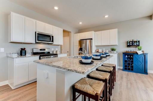 A kitchen built to perform - This newly finished home includes hardware and backsplash. Actual photos coming soon. (Photos of the same floorplan, colors are similar).