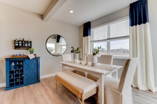 Dining Area off Kitchen (Photos of the same floorplan, colors may vary).