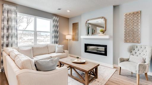 Another look at the main level family room, which flows conveniently with the rest of the space provided in this charming layout! (Photos of the same floorplan, colors are similar)