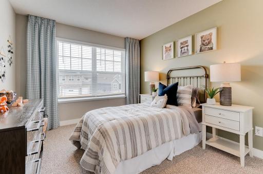 Each of the home's three secondary upper level bedrooms are abundant in space! (Photos of the same floorplan, colors are similar).
