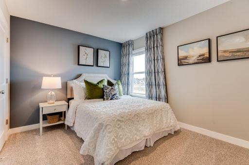 Each of the home's three secondary upper level bedrooms are abundant in space! (Photos of the same floorplan, colors are similar).