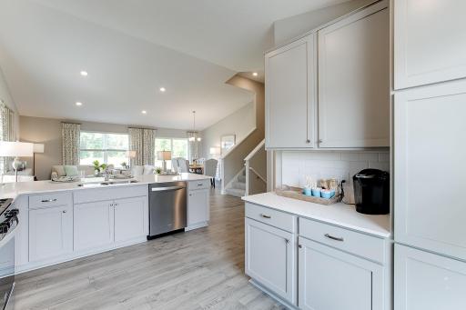 An abundance of cabinet and countertop prep space make this kitchen layout functional and desirable.