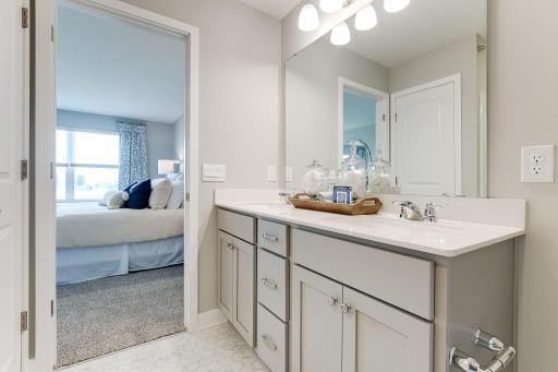 Primary suite comes with a private bath and walk-in closet.