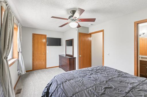 Upper level primary bedroom with walk-in closet