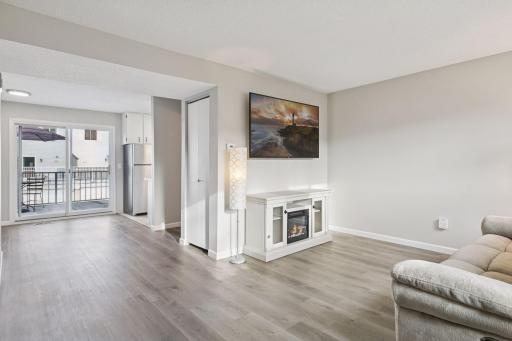 Wonderful natural light front the living room to the dining area.