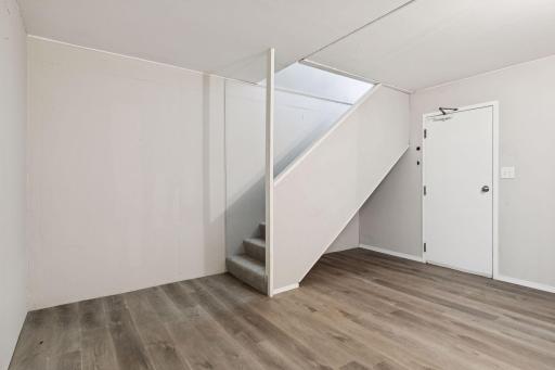 Descend to the lower level mud room/storage/laundry