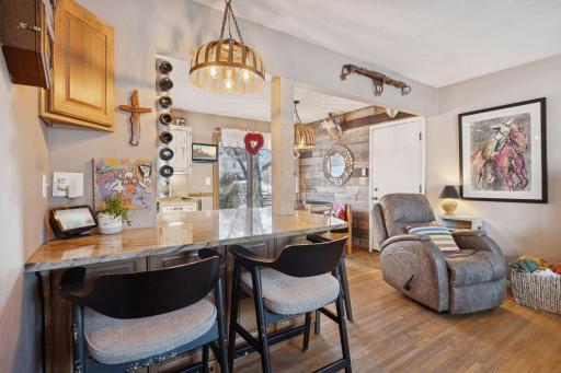 Island/breakfast bar that opens up the space