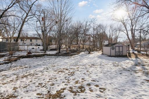 Fenced in Backyard with storage shed