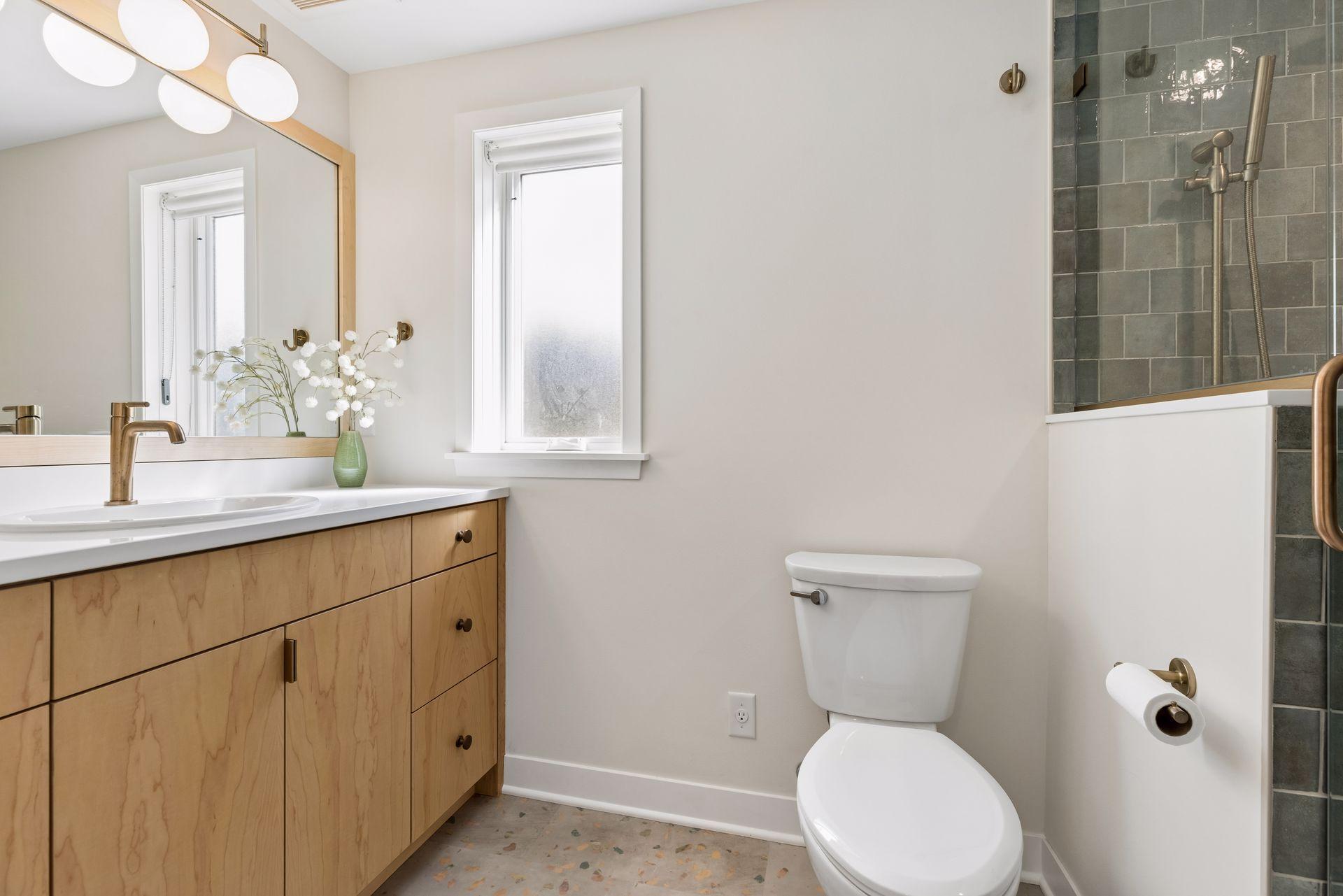 Brand new remodel by Sicora Design/Build on the lower level, includes a gorgeous bathroom upgrade.