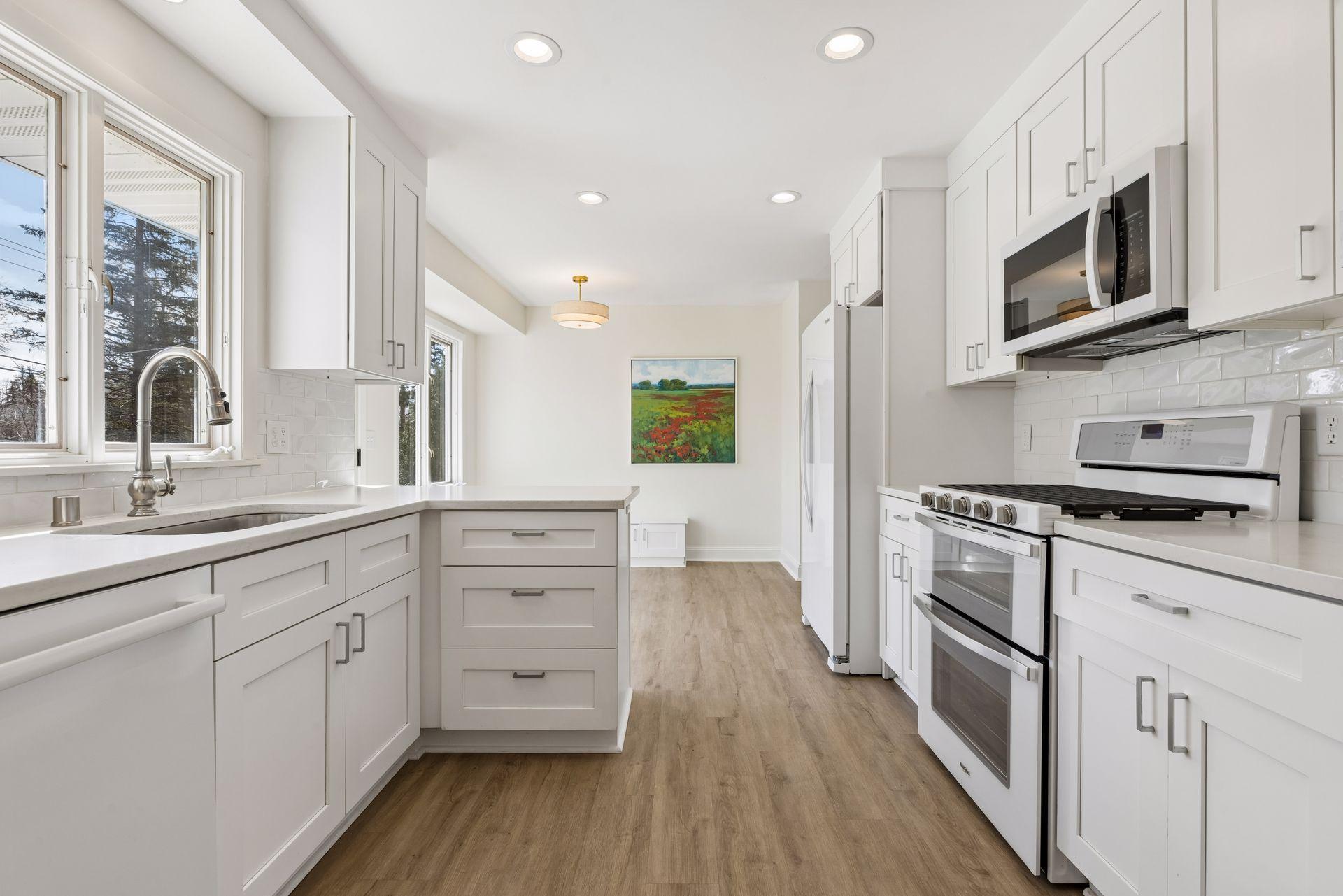 All brand new kitchen appliances, including Whirlpool brand refrigerator, double-oven and gas range.