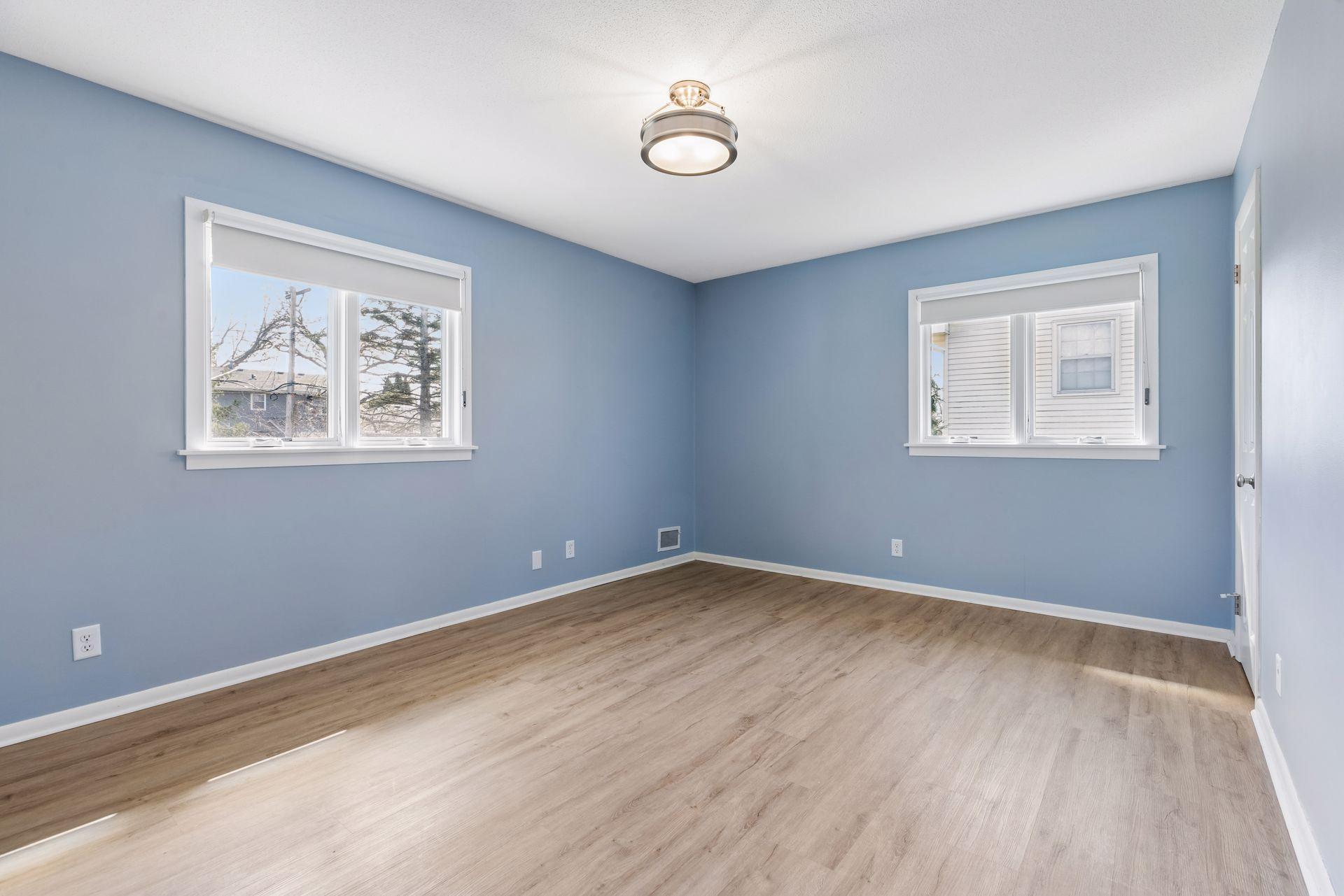 Large primary bedroom suite, with updated blackout shades.