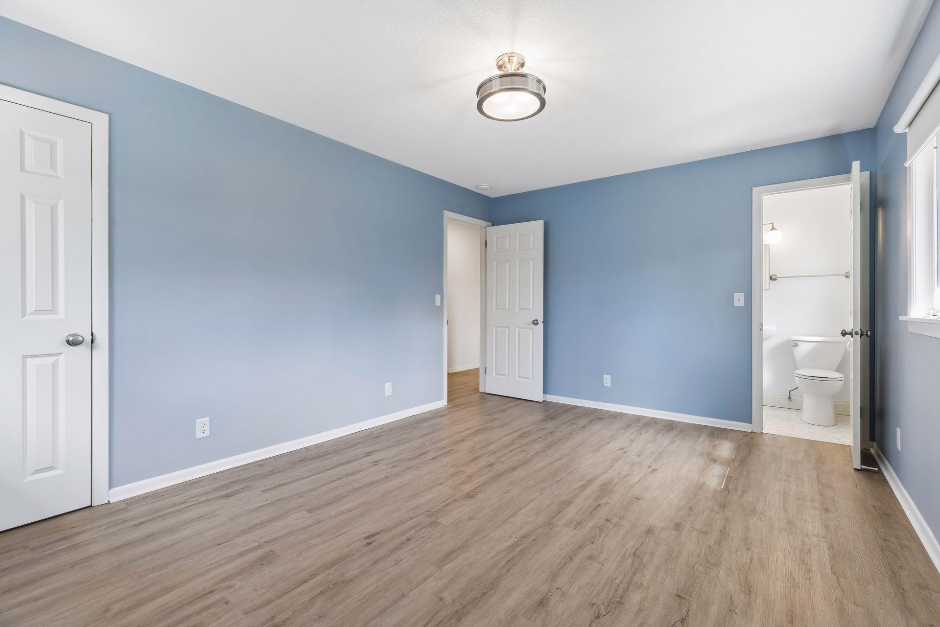 Primary suite with walk-in closet and private 3/4 bath.