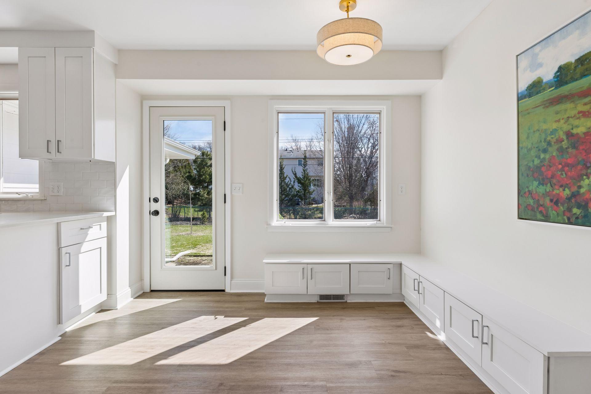Built-in benches, perfect for a breakfast nook. Direct access to the fully fenced backyard.