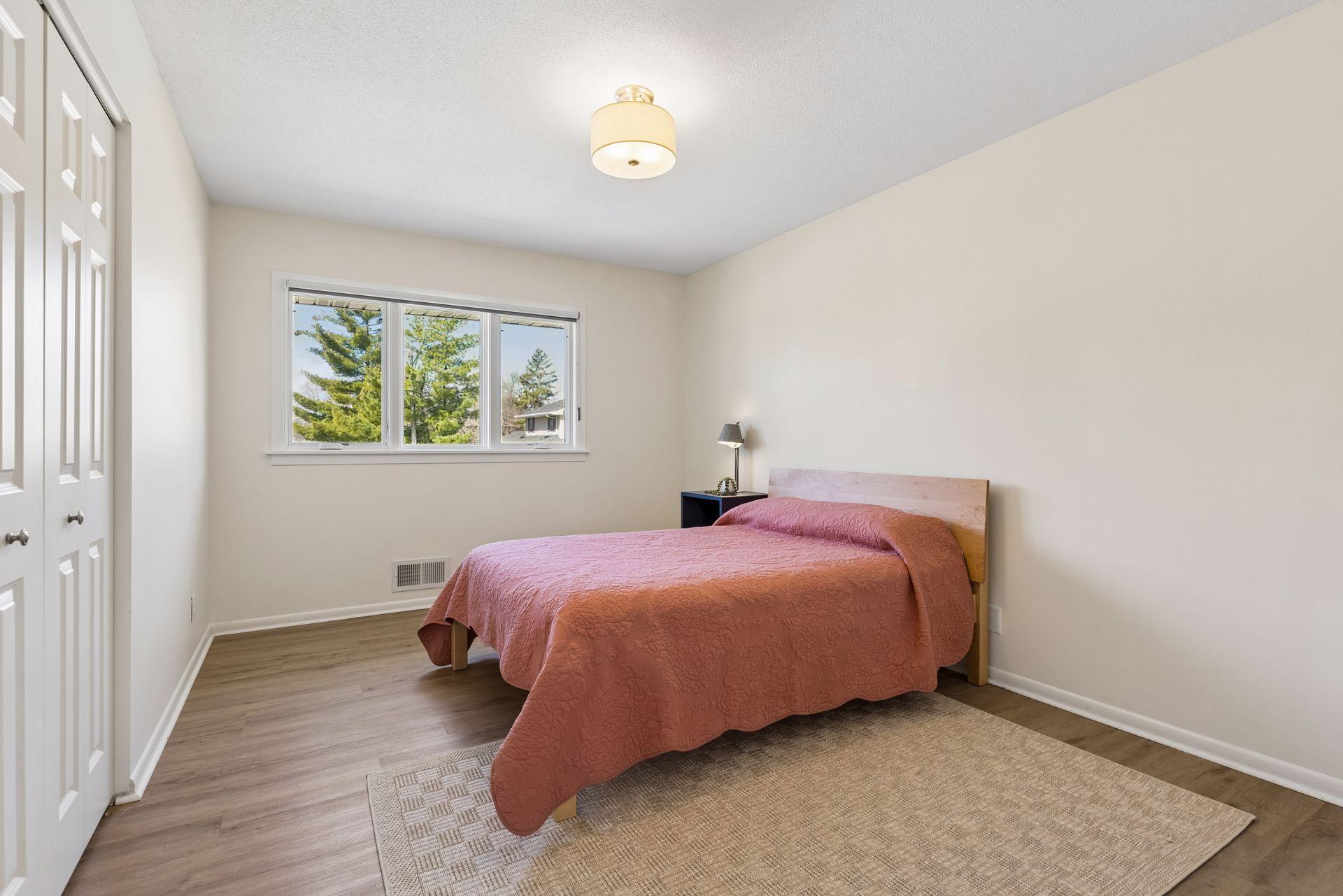Second bedroom upstairs, with custom closet organizers.
