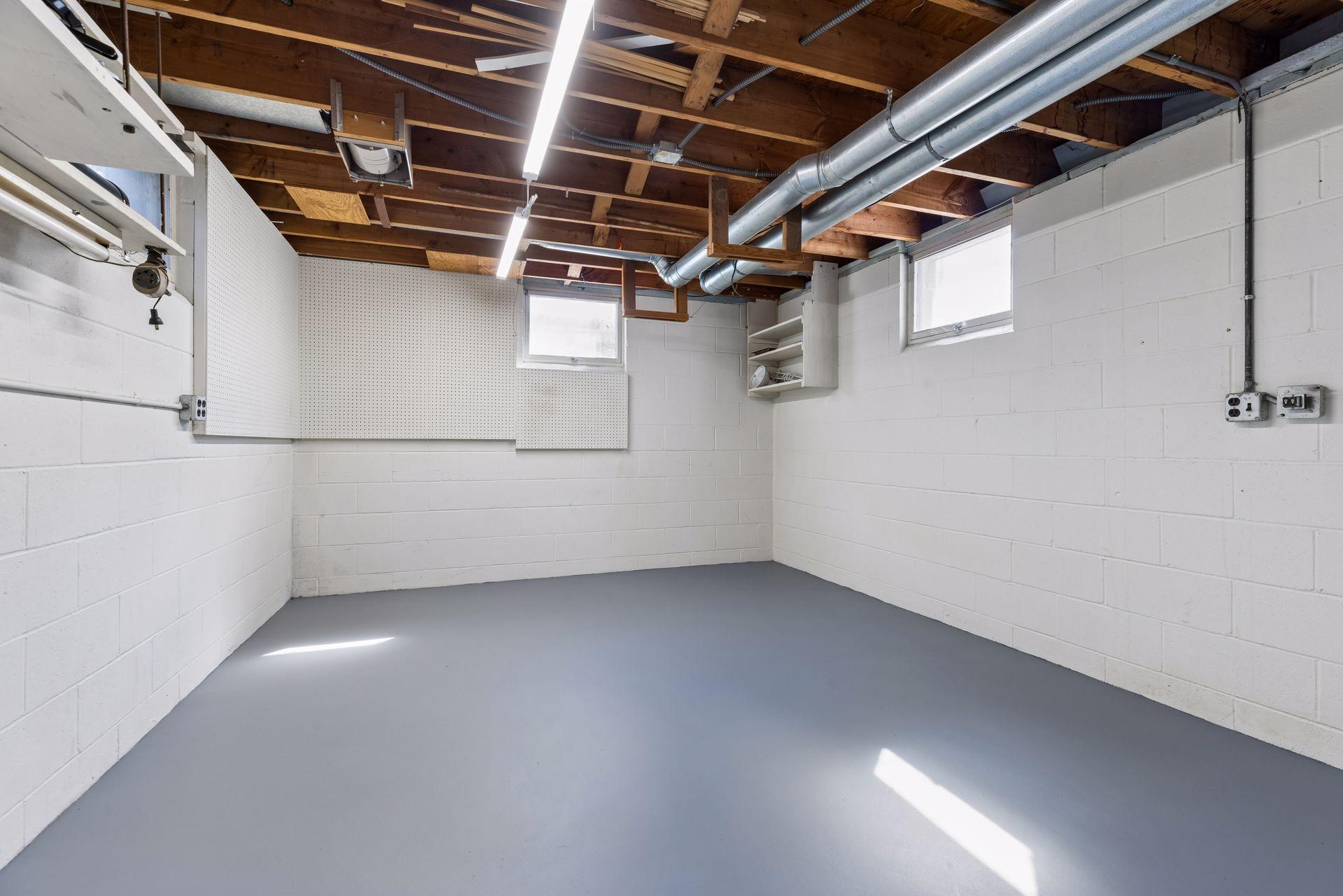 Large workshop. Seller worked with Sicora Design/Build to install a door from the family room that could be finished into a hallway, if wanting to remodel the workshop by adding an egress window and finishing the space to create a additional bedroom.