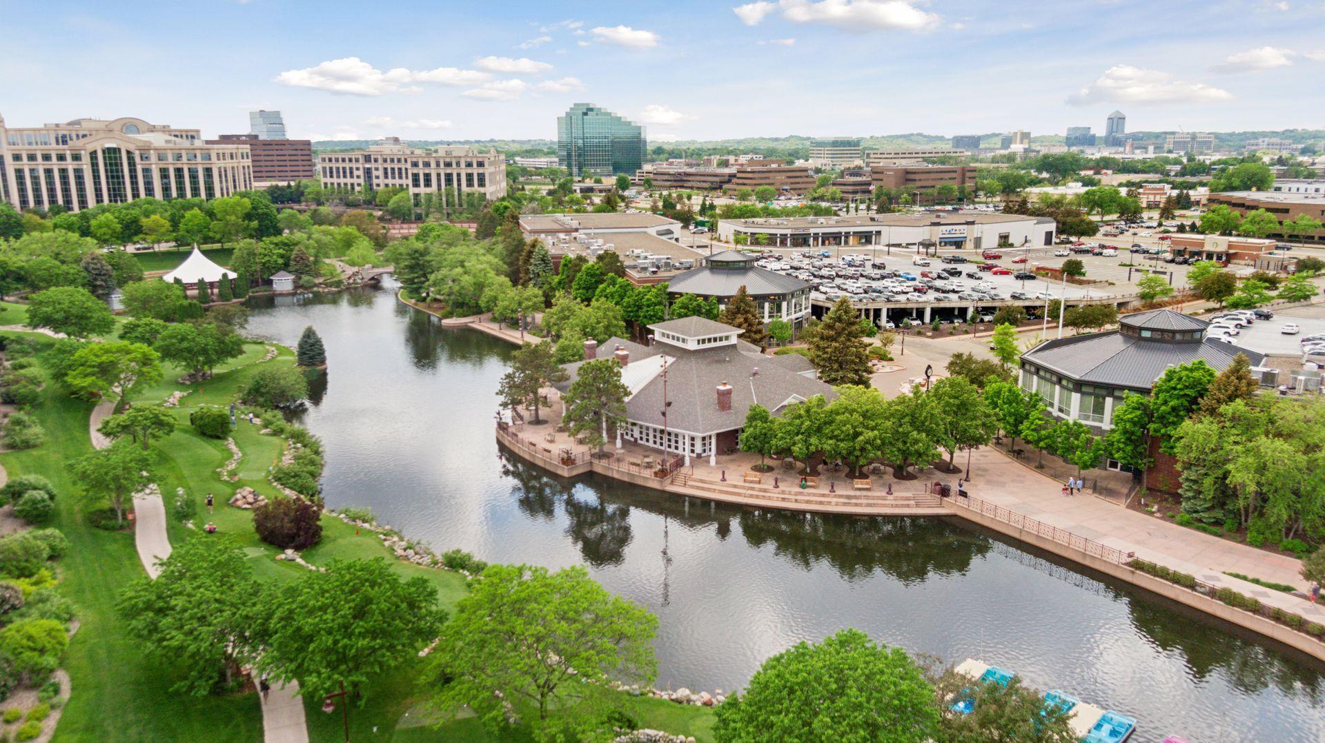 "One of the most distinguishing elements of Centennial Lakes is the 25-acre park. Maintained by the City of Edina, the Park includes 1.5 miles of walking paths alongside the banks of three adjoining lakes."