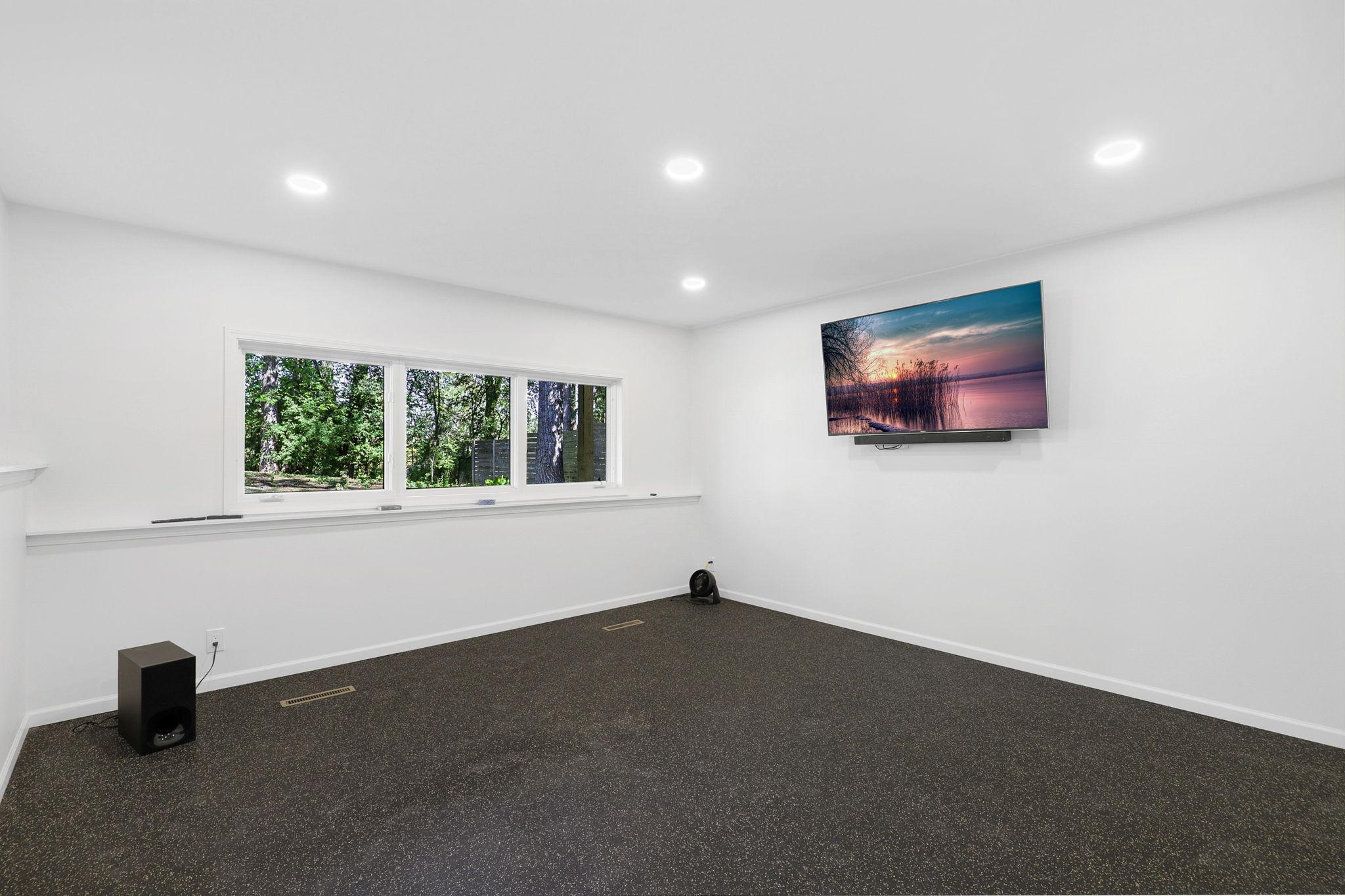 24 - Lower Level Flex Room playroom, exercise room, etc.jpg