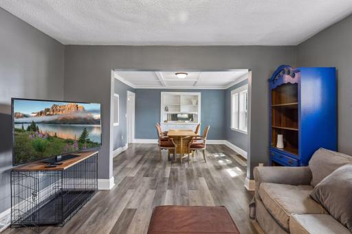 Warm and welcoming open concept living and dining room.