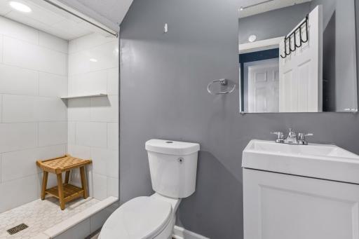 Remodeled main floor 3/4 bath with new walk-in tiled shower.