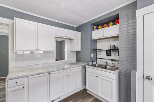 Subway tile backsplash and cut out to the dining room.