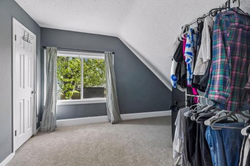 The south facing bedroom is an en suite with private bath and large walk-in closet.