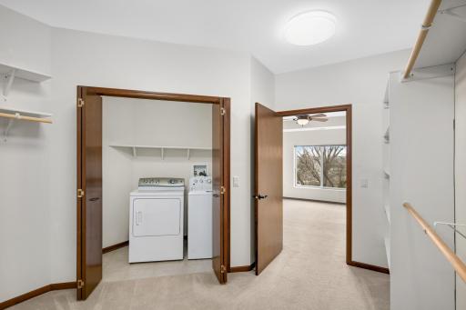 Convenient in-unit laundry located in the walk-in closet