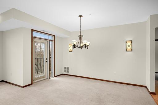 Patio door from informal dining room leads to private screened deck
