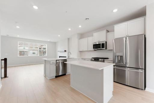 Photos of former model home, options and color selections will vary.